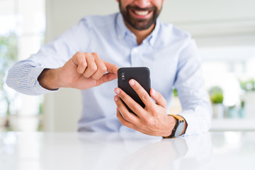 Close up of man using smartphone smiling