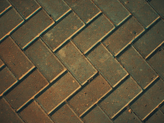 the texture of the old brick tiles is reddish. brick and paving