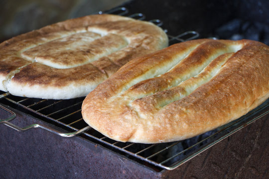 Close-up of pita bread or pita fried over an open fire or grill, concept of a summer holiday or picnic