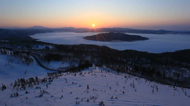 Lake Kussharo and Mount Mashu in winter at sunrise, Japan