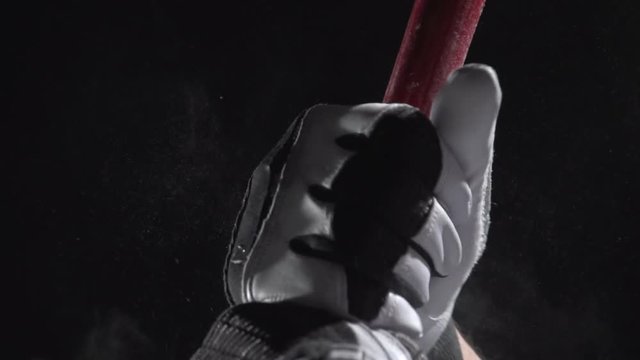 Close up of hands on a baseball bat, slow motion