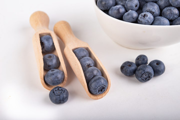 Tasty ripe blueberry fruit on the kitchen table. Ingredients for a delicious dessert in the home kitchen.