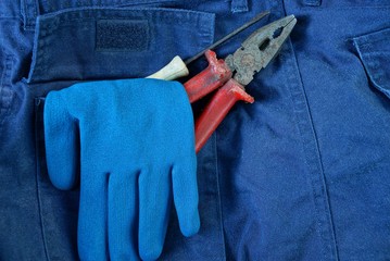 blue work glove and tools in your pants pocket