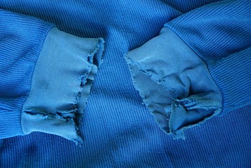 part of the old blue clothes with torn sleeves