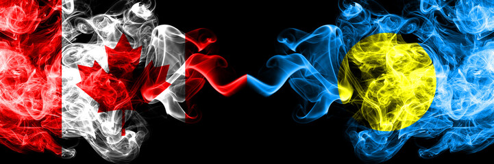 Canada vs Palau, Palaulan smoky mystic flags placed side by side. Thick colored silky smoke flags of Canadian and Palau, Palaulan.