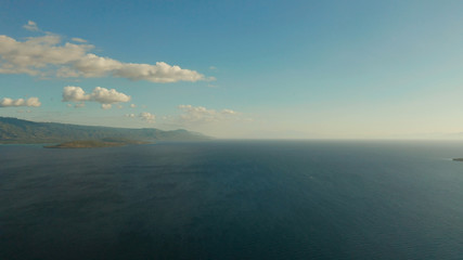Blue sky with clouds over the sea and islands, aerial view. Seascape: Ocean and sky Cebu, Philippines.