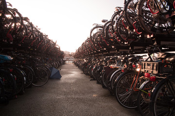 image of bikes in a bike parking with a stunning reflection in the foreground