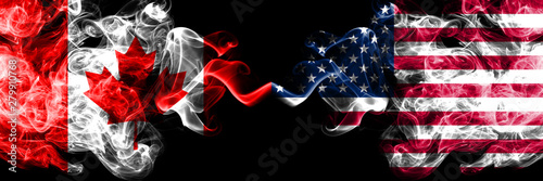 Canada vs United States of America, American smoky mystic flags placed side by side. Thick colored silky smoke flags of Canadian and United States of America, American.