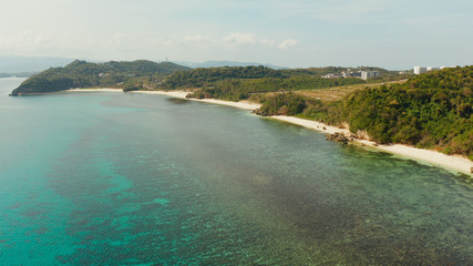 aerial drone: Sandy beach and turquoise water in the tropical resort of Boracay, Philippines, Ilig Iligan Beach. Summer and travel vacation concept.