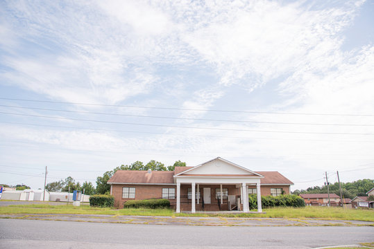 A Rundown Residential And Commercial Property In A Suburban Area With A For Lease Sign.