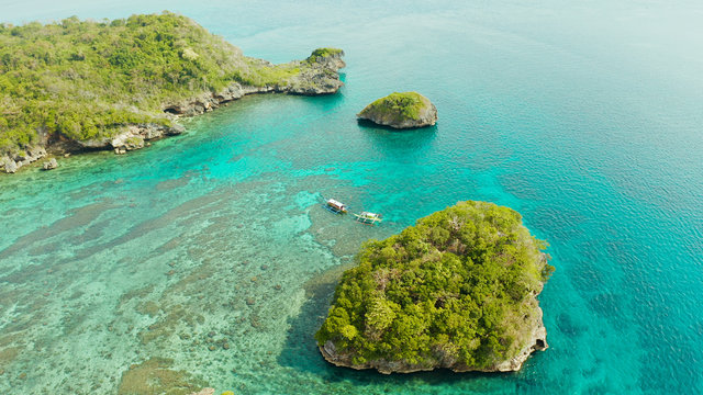 Turquoise lagoon with rocky island and corall reef, aerial view Boracay, Philippines. Summer and travel vacation concept.