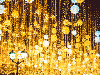 Bright Christmas Street Illumination on the facade of the buildings. Burning lanterns on Nikolskaya...