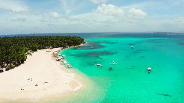 Sand beach and tropical islands, palm trees by atoll with coral reef, top view.Daco island, Philippines. Summer and travel vacation concept