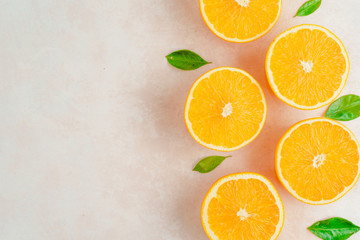 Fresh oranges on on the kitchen board. Top view.