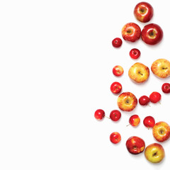 Many different scattered red apples isolated on white background