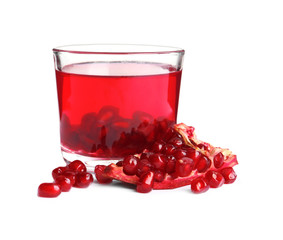 Pomegranate seeds and tasty jelly dessert in glass on white background