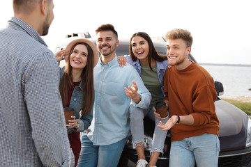 Group of happy people spending time together outdoors