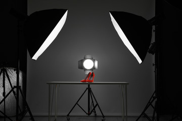 Professional photography equipment prepared for shooting stylish shoes in studio