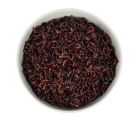 Bowl with delicious cooked brown rice on white background, top view