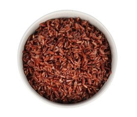 Bowl with delicious cooked brown rice on white background, top view