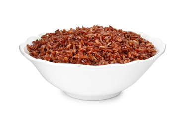 Bowl with delicious cooked brown rice on white background