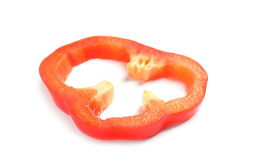 Slice of ripe red bell pepper on white background