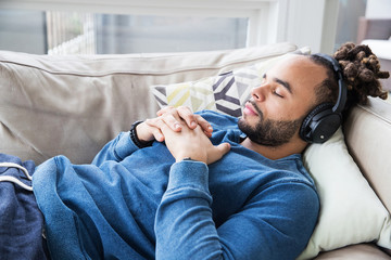 man listening to music with headphones