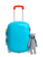 Stylish little blue suitcase with teddy bear on white background