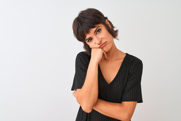 Young beautiful woman wearing black t-shirt standing over isolated white background thinking looking tired and bored with depression problems with crossed arms.