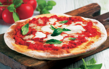 Pizza Margherita with tomato, mozzarella cheese and basil.