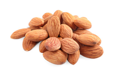 Organic dried apricot kernels on white background