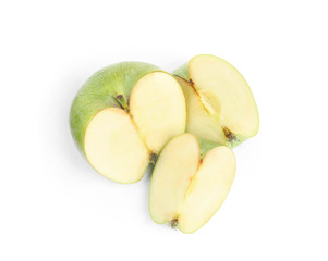 Pieces of fresh green apple on white background, top view