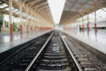 Fototapeta na wymiar Blurred of railway tracks at train station,abstract for background