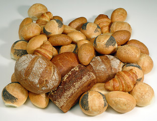 A photograph of a pile of assorted fresh bread