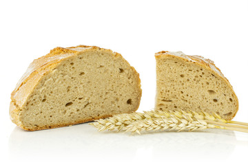 Group of one half one slice of fresh baked rye wheat bread with three golden wheat ears isolated on white background