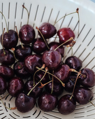 Fresh cherry on clear plate on wooden background. fresh ripe cherries. sweet cherries.