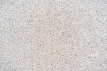 Sand texture background, natural sand at the beach close up.