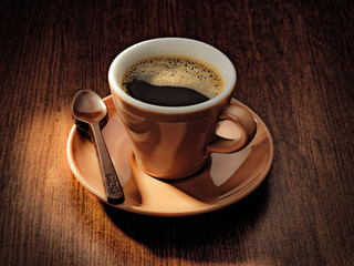 cup of coffee on wooden background