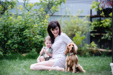 Fototapeta premium I dream about the dog. If I had a dog. Do not dream of a dog, take it from an animal shelter. mother and daughter took the dog from the shelter. Love to the animals.