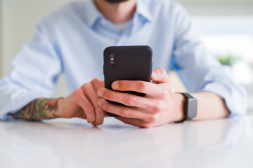 Close up of business man working using smartphone