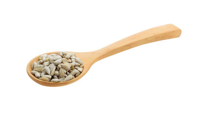 sunflower seeds in wood spoon isolated on white background
