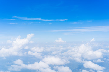 Group of the clouds in the sky from above angle.  Beautiful blue sky and clouds from airplane background.