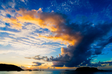 Fototapeta na wymiar A cloudy sunset over Cinnamon Bay, St. John, USVI