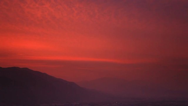 Zoom out of Chikuma River in mountain landscape at sunrise, Japan