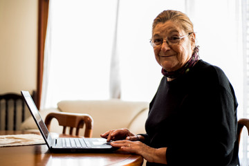 senior woman working with laptop