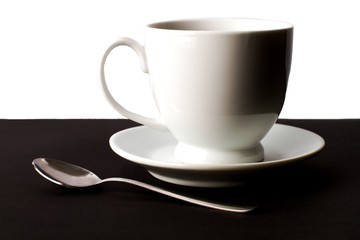 White Cup and Spoon on the Table