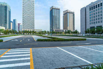 empty car park with city skyline background.