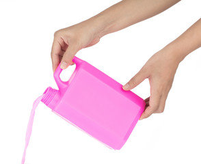 Hand holding pink detergent bottle isolatedon white background