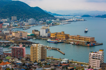 Kitakyushu, Japan - 20 November 2016: A view of Mojiko Port, a large port city and commercial center Viewed from the Kanmon Strait and Kanmonkyo Bridge