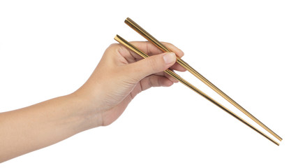 Hand holding Gold Chopsticks isolated on white background